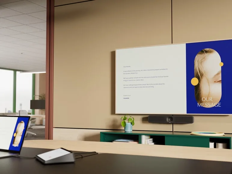 Meeting room set up for laptop-driven presentation over a wall display